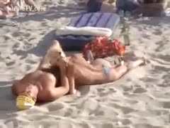 On the beach, a gorgeous couple is having a blast.